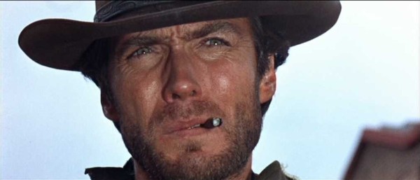 Clint Eastwood close-up with cigar and cowboy hat in A Fistful of Dollars