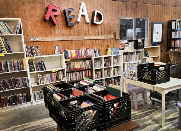 A bookstore with the word "Read" on the wall and cozy chairs.