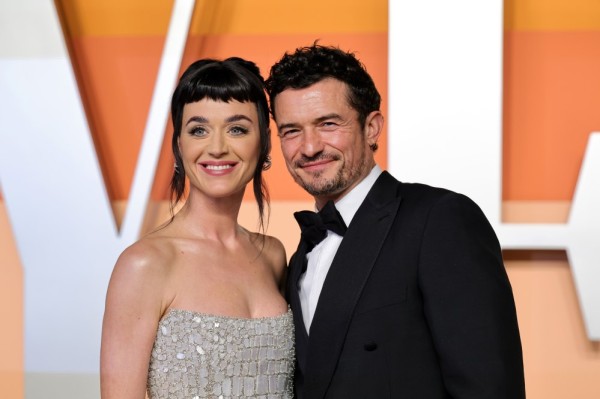 Katy Perry and Orlando Bloom attending the 2025 Vanity Fair Oscar party.