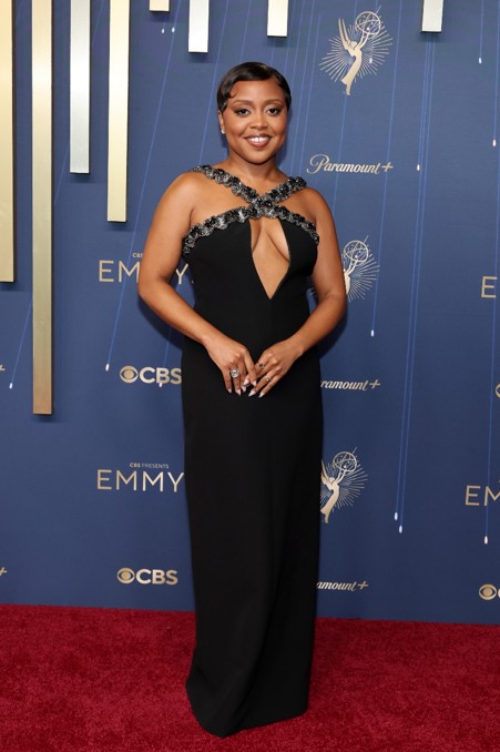 event attendee in a black gown at an award ceremony