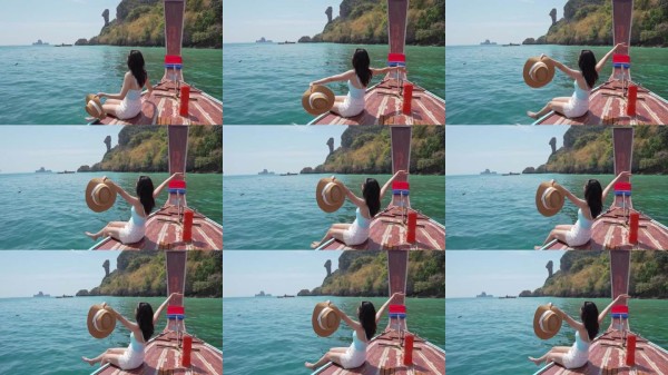 年轻的亚洲女性在泰国甲米的鸡岛放松享受,夏季度假旅行。