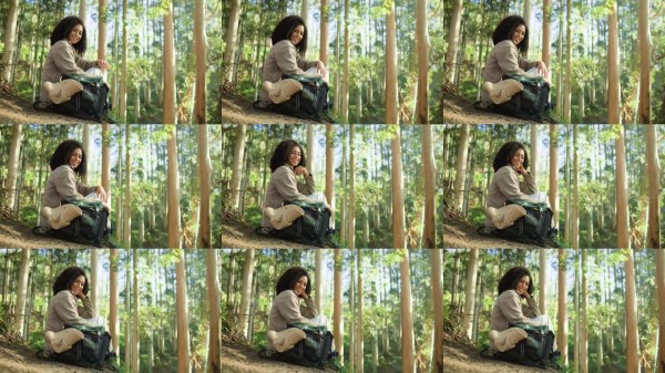 面部特写,女性在森林中徒步旅行,微笑放松,享受冒险,观光探索。户外,登山者和快乐的人在树林中,环境与