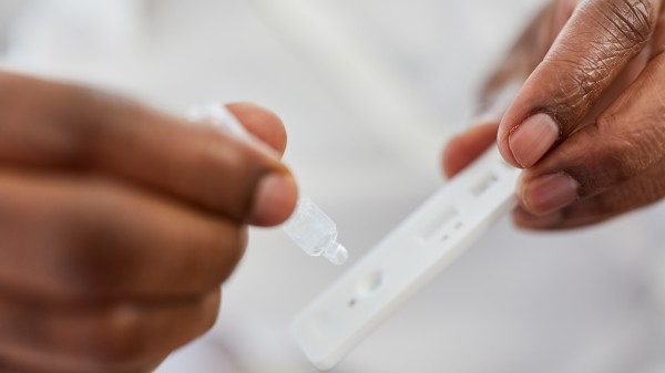 A person setting up a COVID-19 self-test