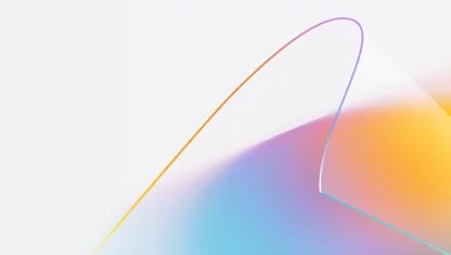 Una forma ondulada translúcida con un degradado de colores de amanecer que brilla a través de ella.