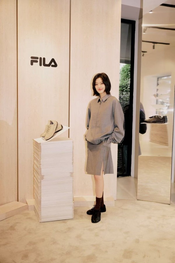 fashion display featuring a model and fila branding