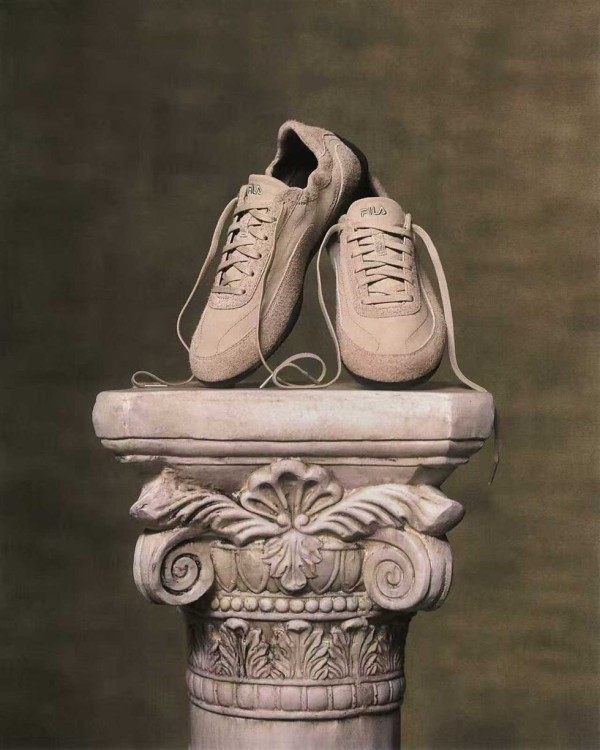 sneakers displayed on a classical column